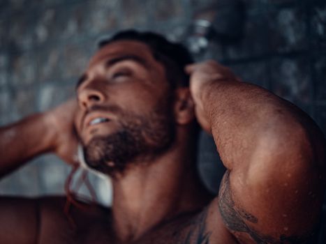 Topless Man With Red and White Earbuds