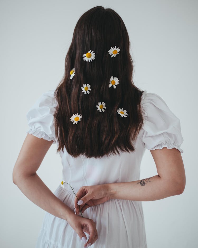 A Woman With Daisies On Her Hair 