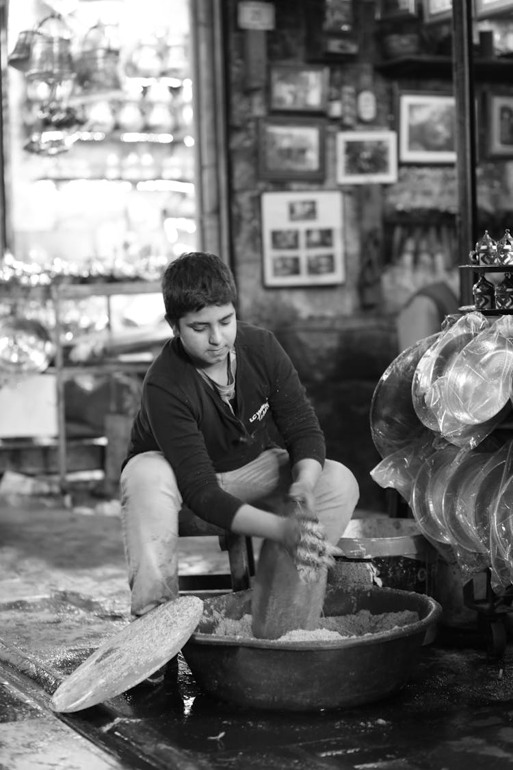 Teenage Boy Working In Workshop