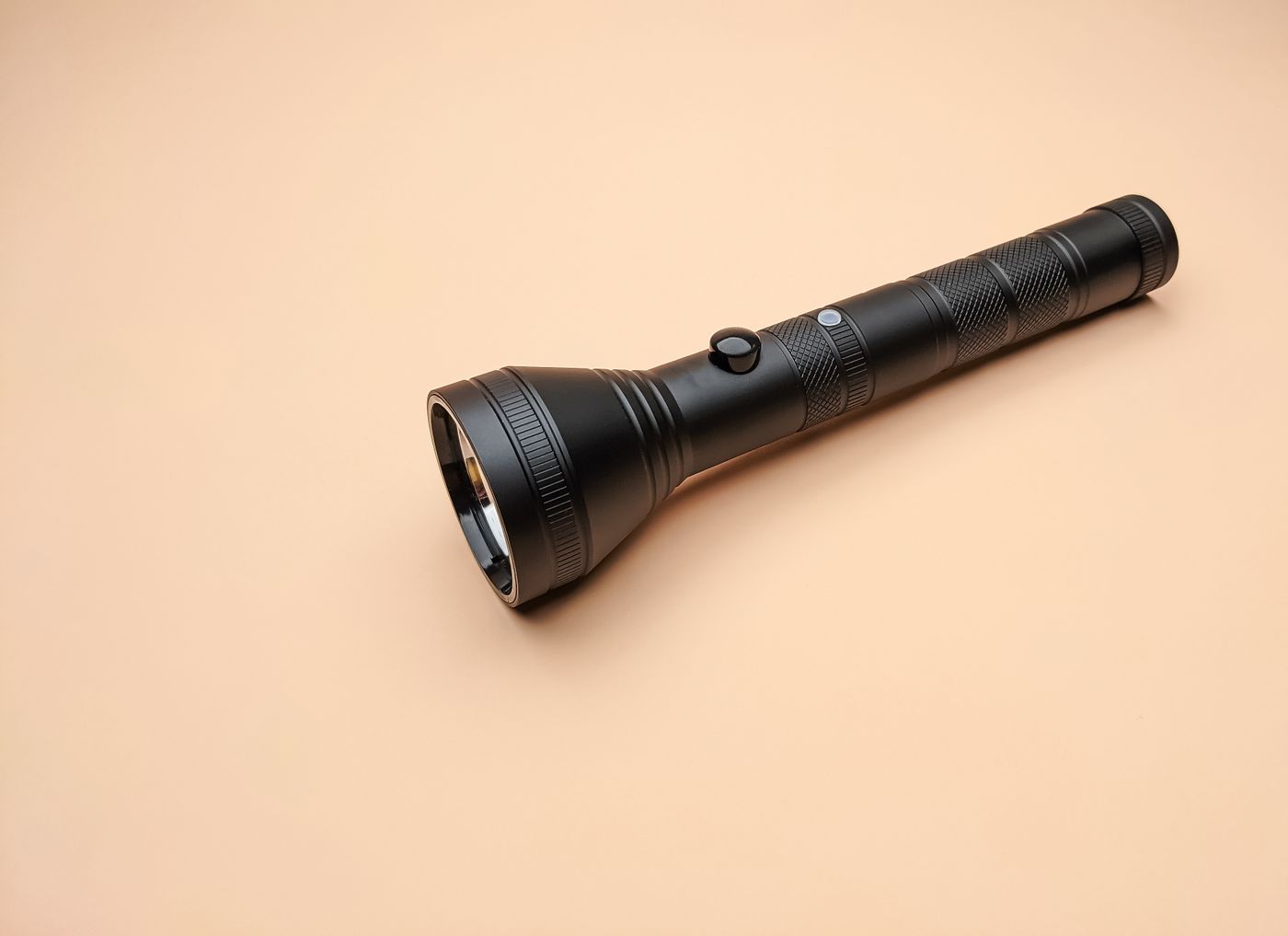 Black flashlight on a neutral surface