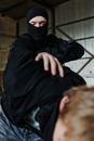 Man in Black Hoodie Covering His Face