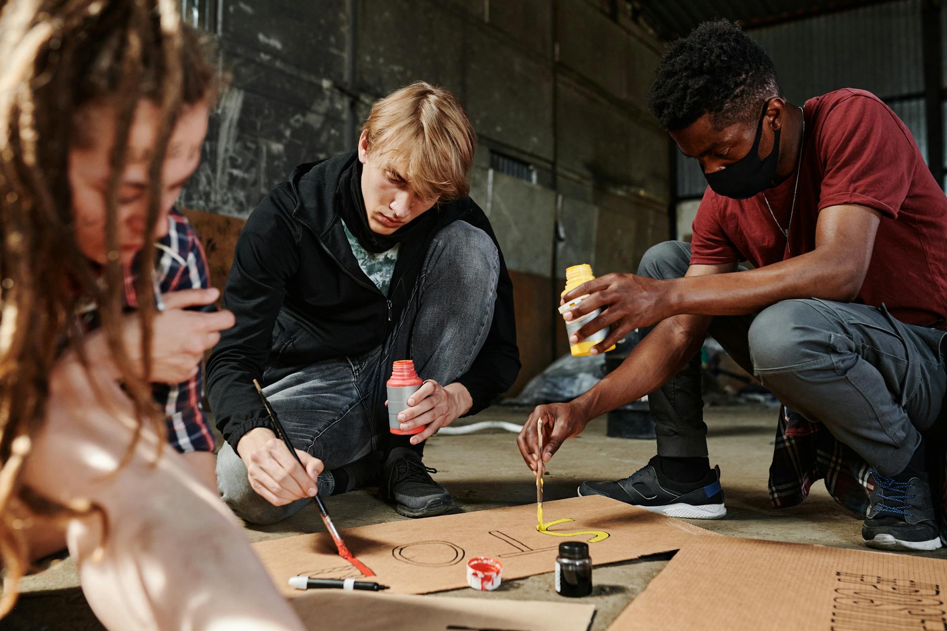 People Painting Banners