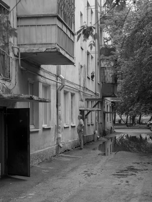 Grayscale Photo of Concrete Buildings