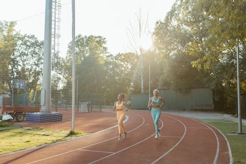 Women Jogging at a Sports Ground