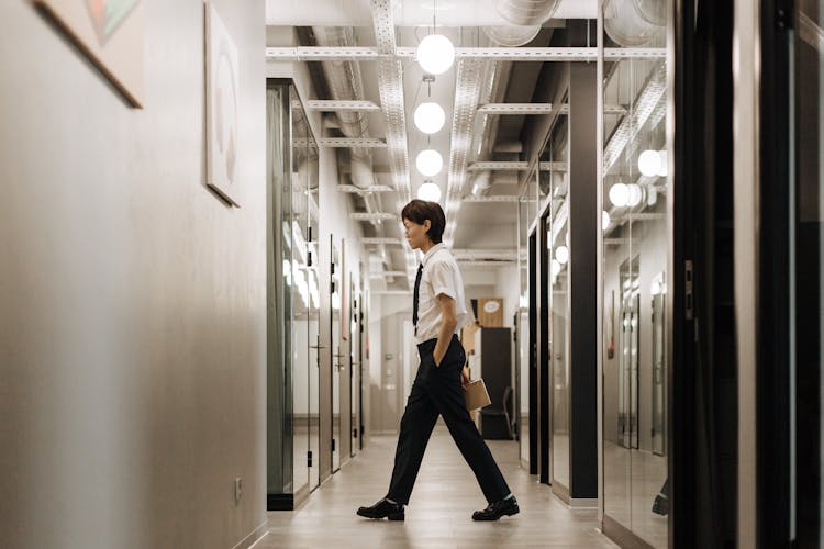 Man Walking At A Hallway