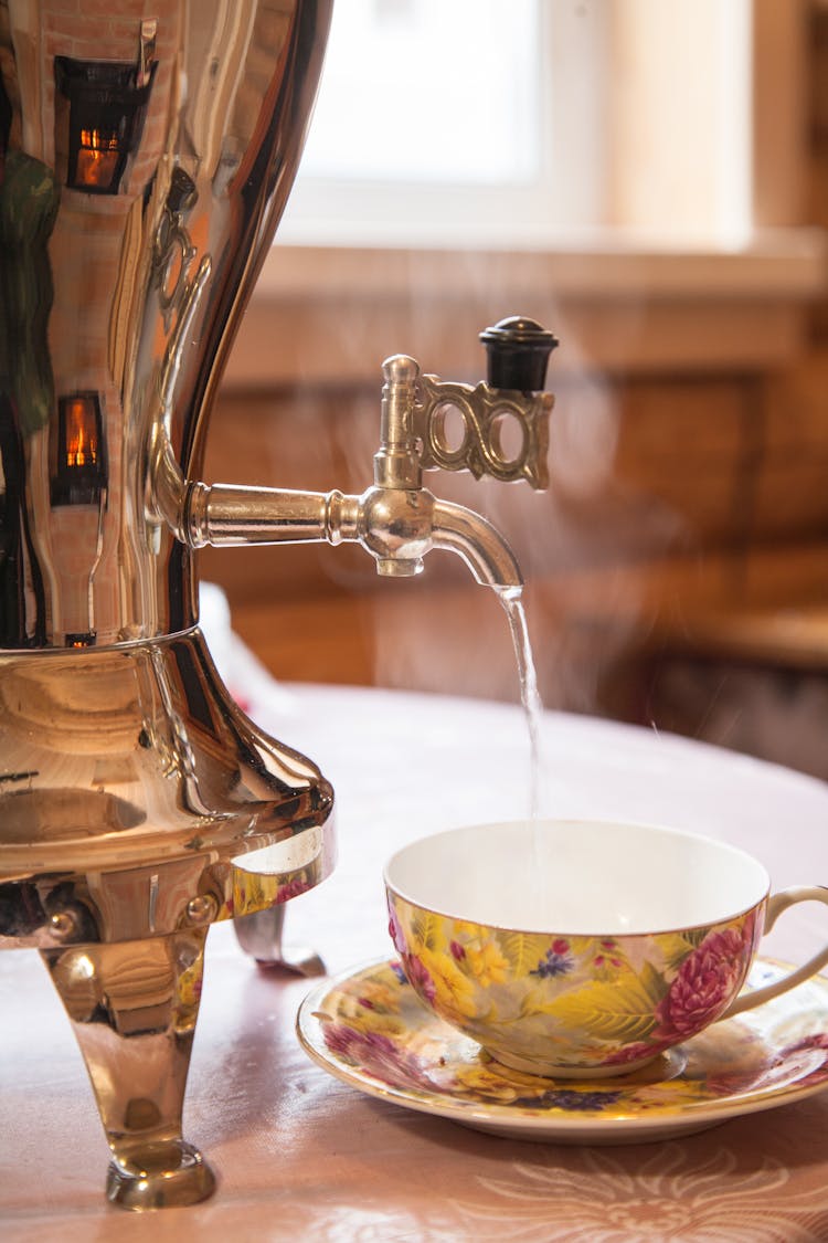 Machine Pouring Hot Water To Cup