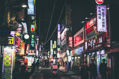 People Walking on Neon Street at Night in Seoul Korea