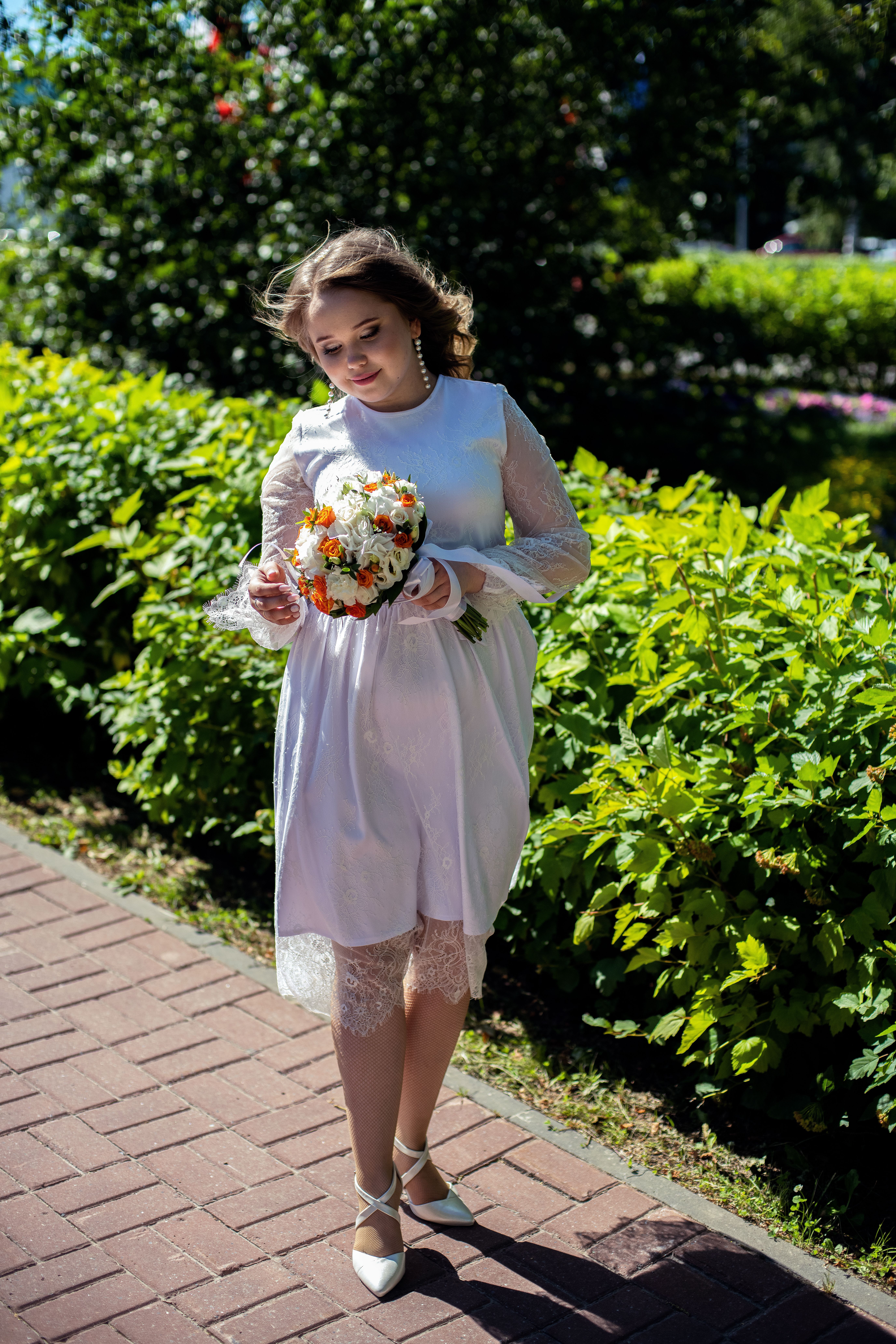 Woman in White Dress Holding Bouquet of Flowers · Free Stock Photo