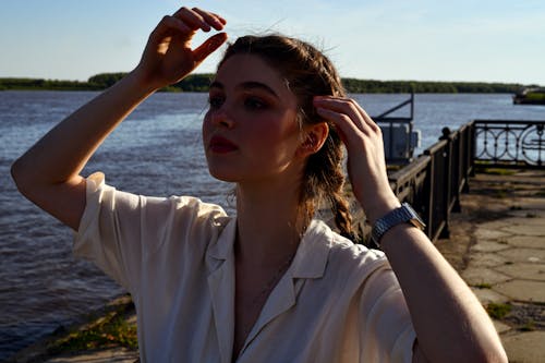 Woman Wearing Blouse and Makeup near Sea