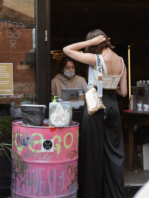 Elegant Woman Buying Coffee on City Street