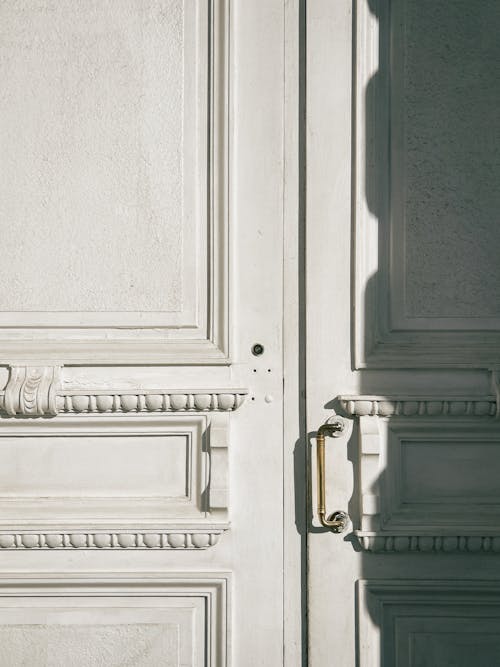 A White Wooden Door with Brass Handle