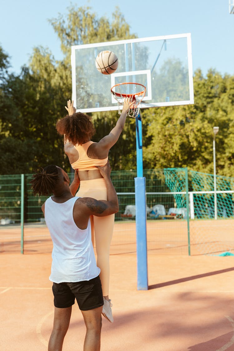 A Woman Shooting A Ball 