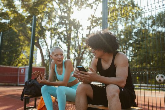 2 Women Sitting on Bench