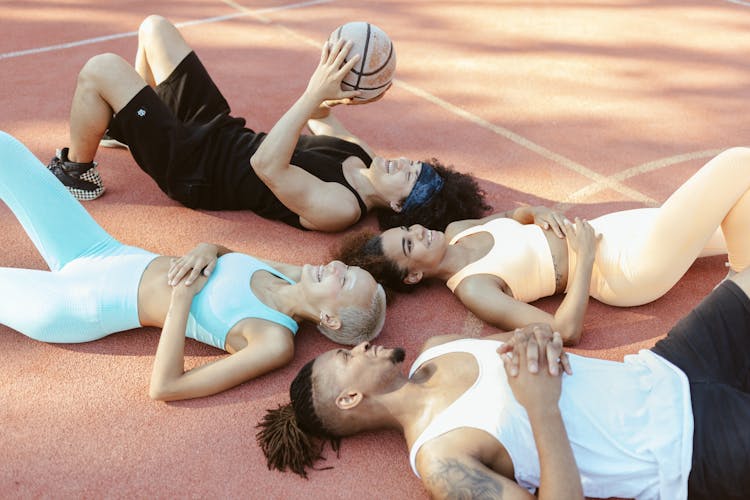 People Lying On The Basketball Court