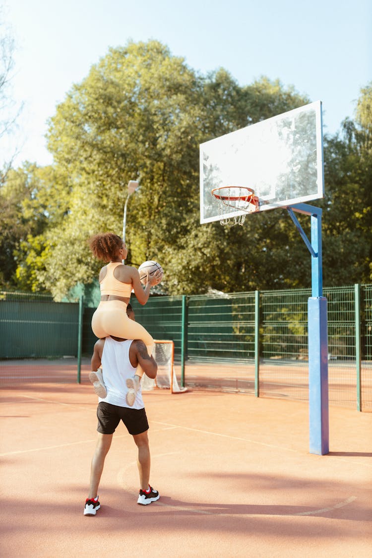 Couple Plying Basketball Together