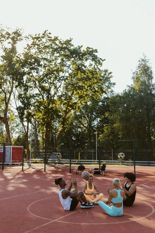 Free People Playing Basketball on Basketball Court Stock Photo