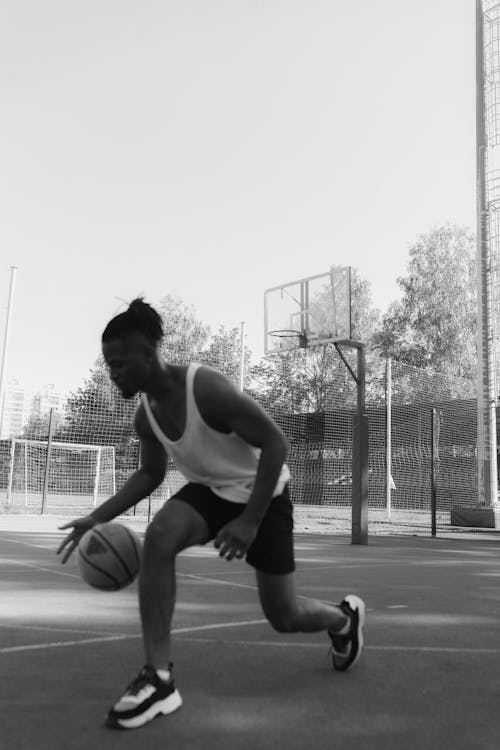 A Man Dribbling a Ball 