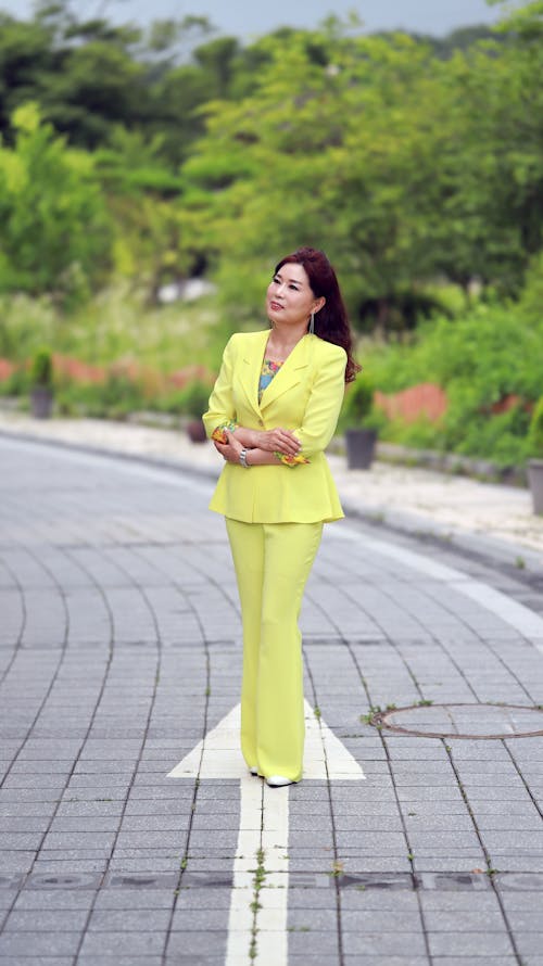 
A Woman Wearing a Yellow Suit