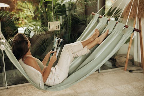 Woman Lying on Gray Hammock 