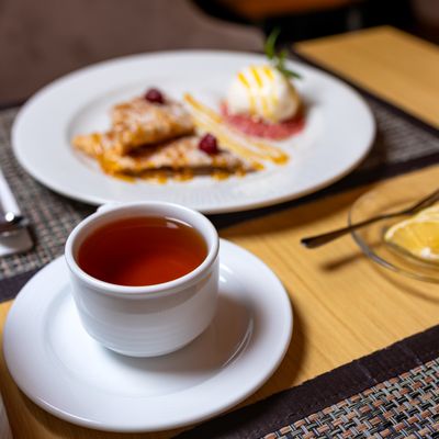 Warm cup of spiced tea on a dining table — photo by Farhad Ibrahimzade on Pexels