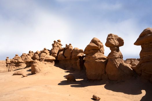 Brown Rock Formation Under White Clouds