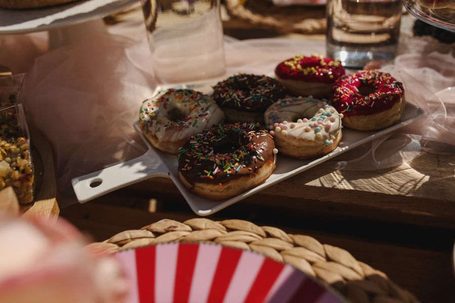 Assortment of freshly glazed doughnuts — photo by Melike B on Pexels