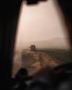 A Vehicle on Dirt Road