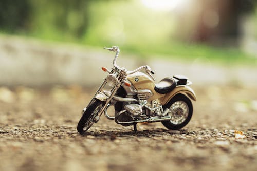 Brown Miniature Motorcycle on Dirt Road