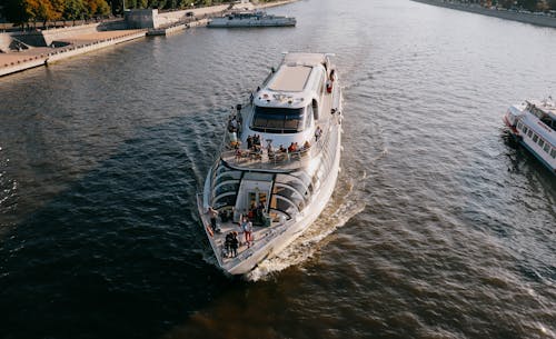 White and Blue Boat on Water