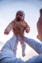 Baby in Brown Hoodie and Blue Denim Jeans