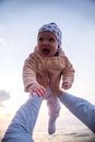 Baby in Brown Hoodie and Blue Denim Jeans