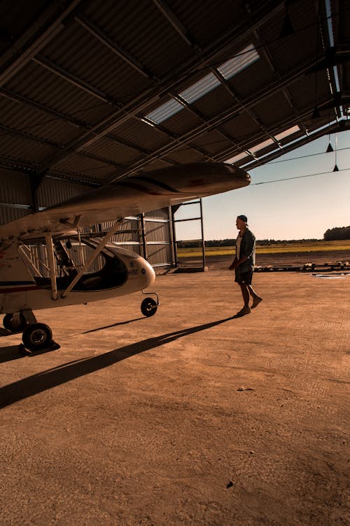 Man and Plane in Hangar