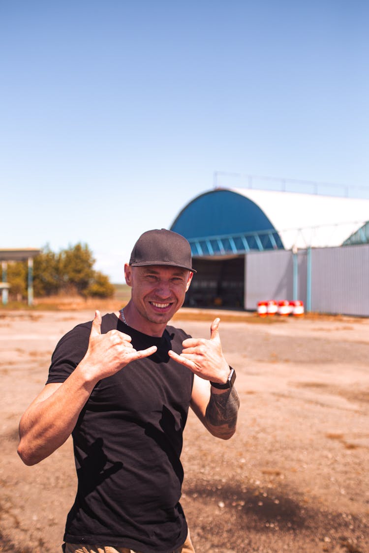 Smiling Man Wearing All Black Casual Clothing Outdoors In Summer 