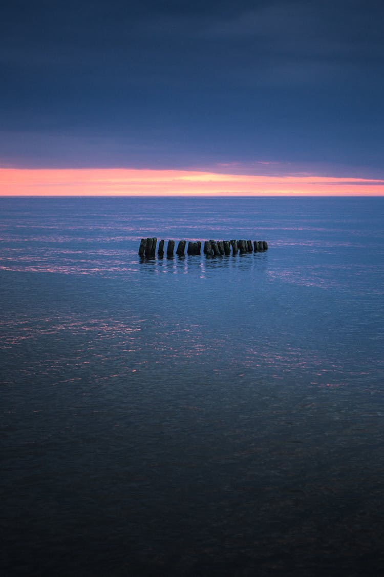 
Wooden Posts In The Ocean