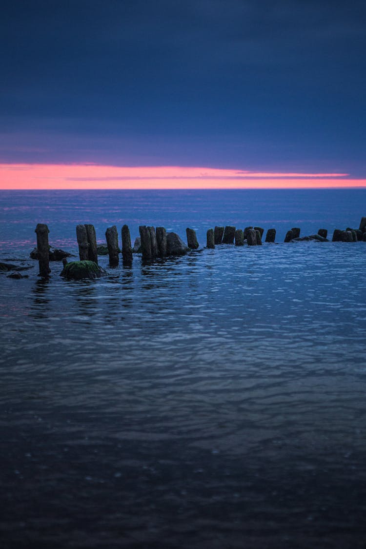 
Wooden Posts In The Ocean