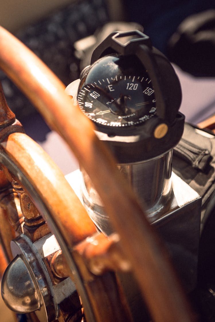 Black Boat Compass At The Helm 