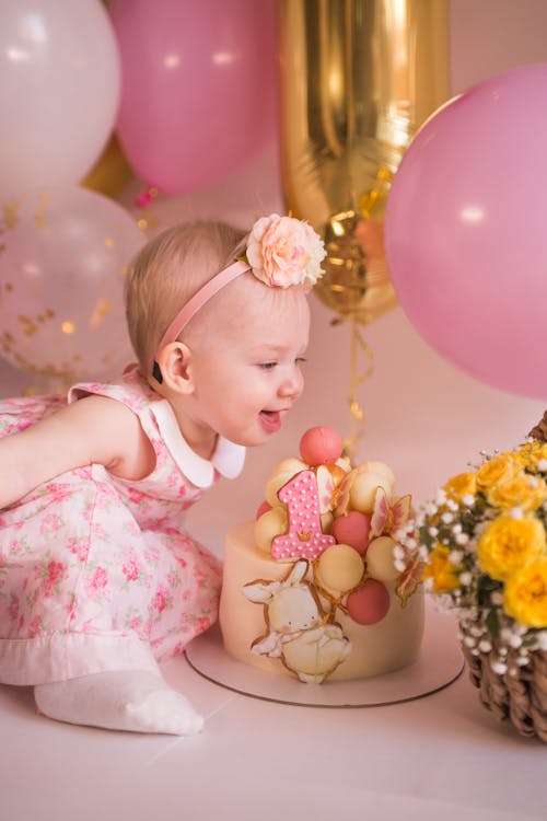 Free Baby Girl with Birthday Cake Stock Photo