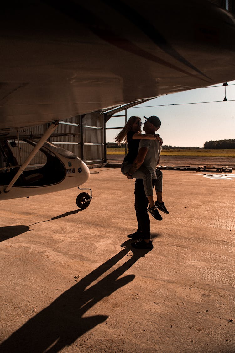 A Couple In A Hangar