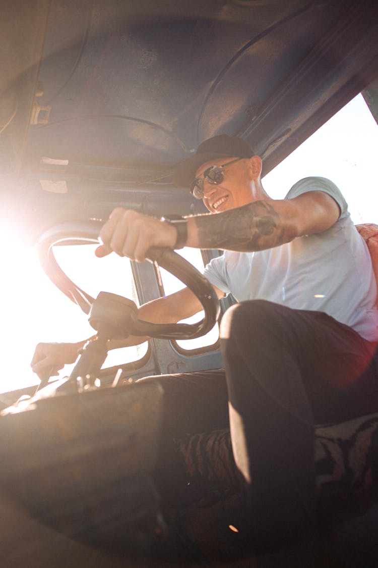 A Man Driving A Vehicle