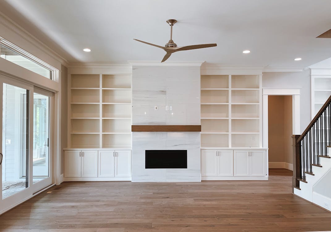 White Wooden Shelves on Brown Wooden Floor