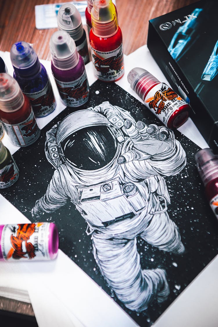 Illustration Of An Astronaut And Paint Bottles 