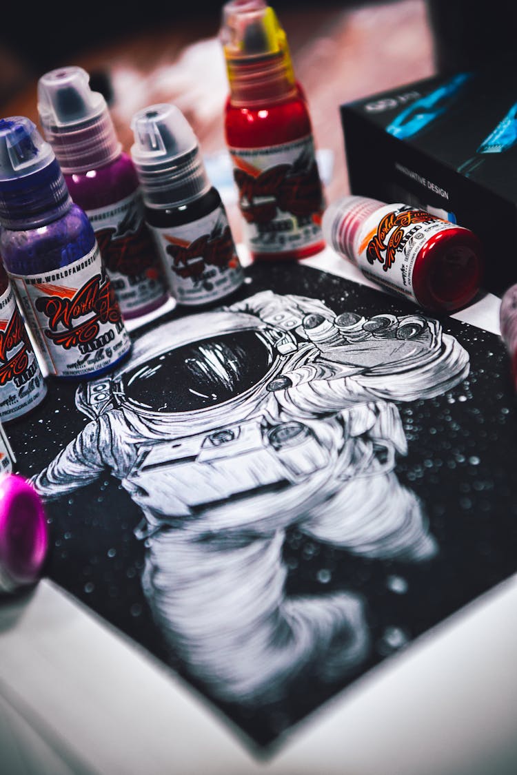 Illustration Of An Astronaut And Paint Bottles 