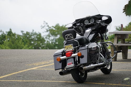 A Black Motorcycle Parked on the Road