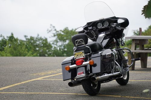 Free A sleek motorcycle parked in a scenic outdoor area, ideal for travel themes. Stock Photo