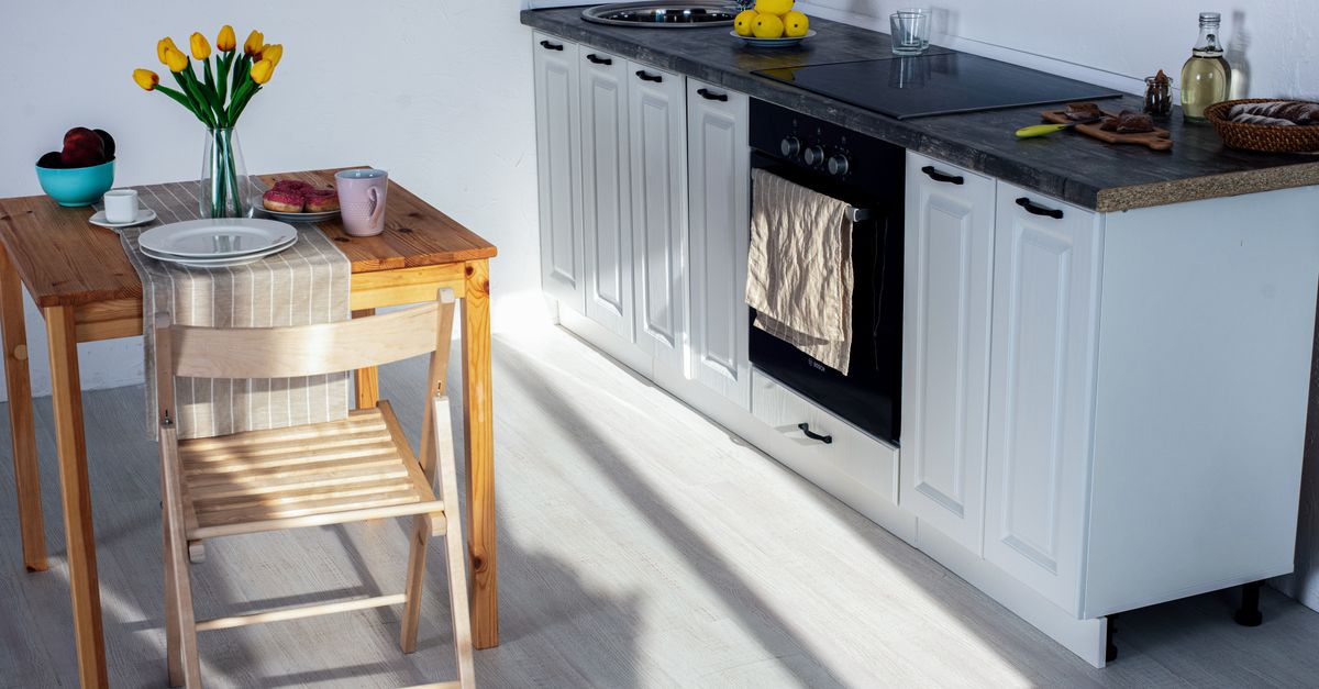 A bright, welcoming kitchen with warm wooden furniture.