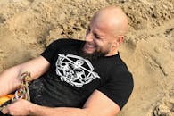 A Bearded Man Pulling a Rope