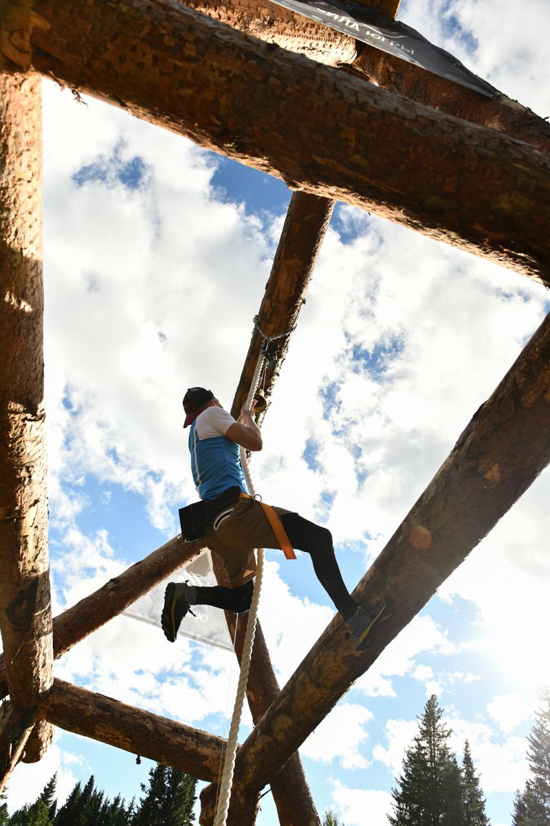Aspirant climbing a rope during an obstacle course