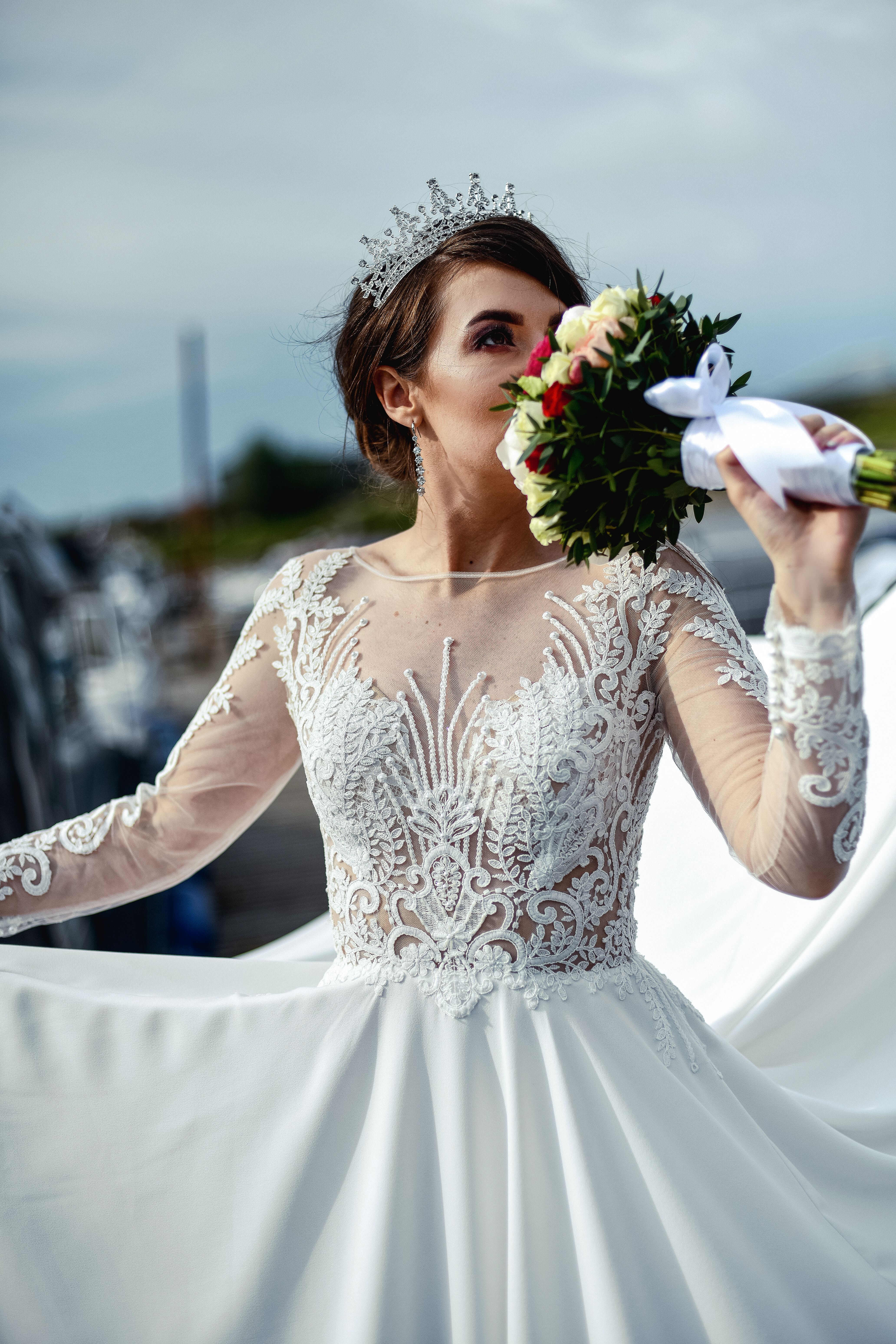 Woman in White Wedding Dress Holding a Bouquet of Flowers · Free Stock ...