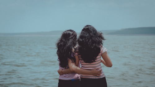 Free Two Women Looking the Ocean Stock Photo