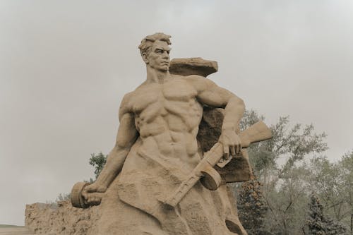 Man Holding Rifle Statue